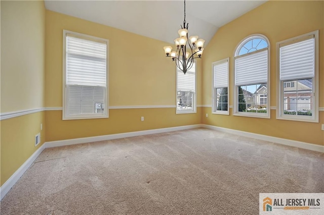 carpeted empty room with an inviting chandelier, baseboards, visible vents, and lofted ceiling