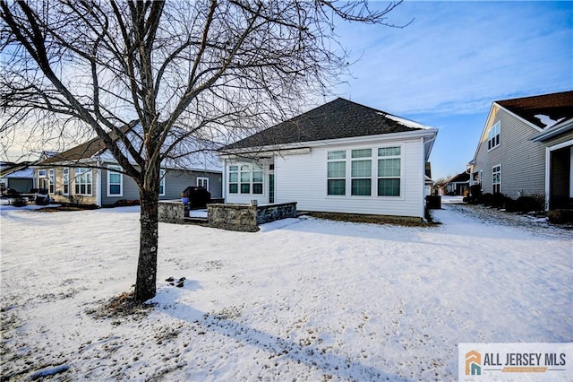 view of snow covered house