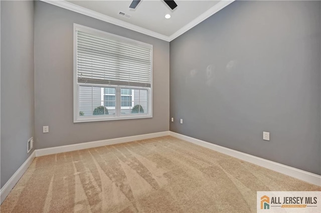 unfurnished room featuring visible vents, baseboards, ornamental molding, carpet flooring, and a ceiling fan