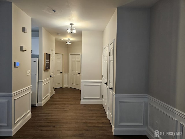 16 Park Sq, Metuchen, NJ 08840 - corridor with a decorative wall, dark wood-type flooring, and a wainscoted wall