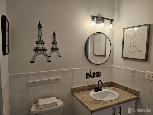 16 Park Sq, Metuchen, NJ 08840 - half bath featuring vanity, tile walls, and wainscoting
