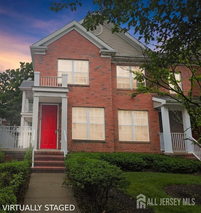 16 Park Sq, Metuchen, NJ 08840 - view of front of property with brick siding and a balcony
