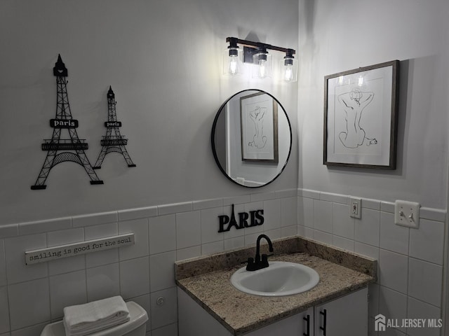 16 Park Sq, Metuchen, NJ 08840 - half bathroom with tile walls, vanity, and a wainscoted wall