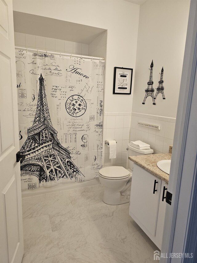 16 Park Sq, Metuchen, NJ 08840 - bathroom featuring vanity, wainscoting, a shower with curtain, tile walls, and marble finish floors