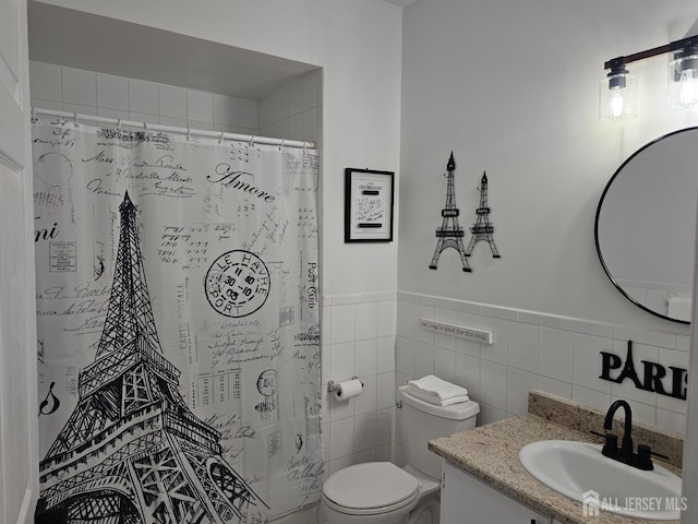 16 Park Sq, Metuchen, NJ 08840 - bathroom featuring vanity, a shower with curtain, tile walls, and a wainscoted wall