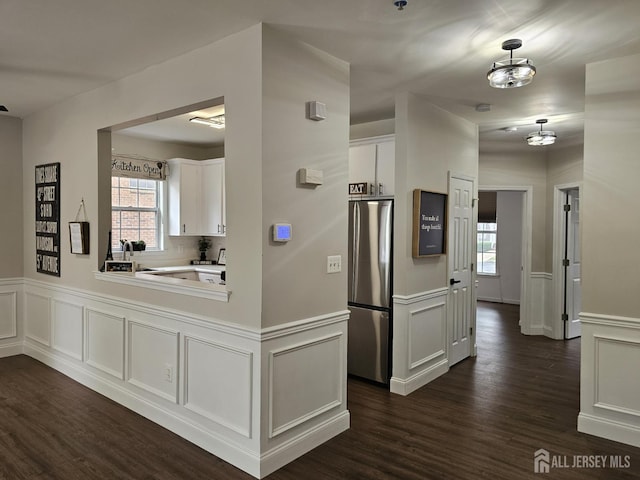 16 Park Sq, Metuchen, NJ 08840 - kitchen with freestanding refrigerator, a decorative wall, dark wood-style floors, white cabinetry, and plenty of natural light