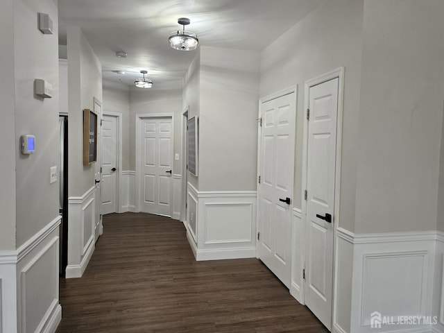 16 Park Sq, Metuchen, NJ 08840 - corridor with a decorative wall, dark wood-type flooring, and a wainscoted wall