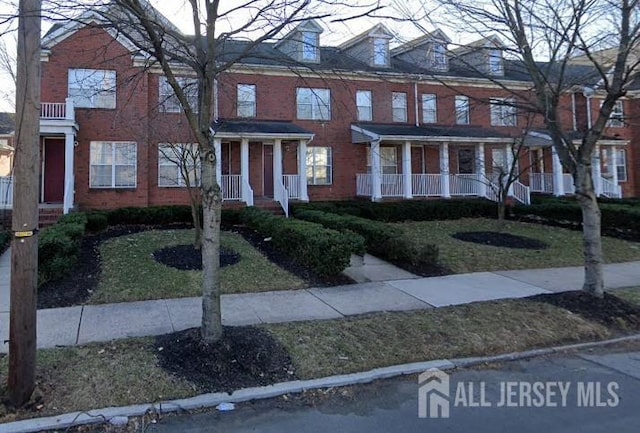 16 Park Sq, Metuchen, NJ 08840 - view of front of property with brick siding and a front lawn