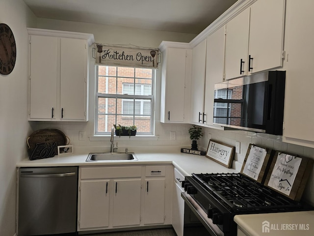 16 Park Sq, Metuchen, NJ 08840 - kitchen featuring stainless steel dishwasher, range with gas stovetop, backsplash, and white cabinets