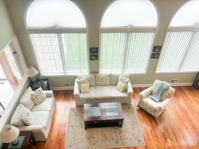 living room featuring baseboards and wood finished floors
