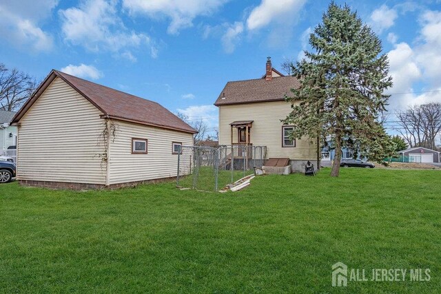 186 Brahma Ave, Bridgewater, NJ 08807 - back of property with a chimney and a lawn