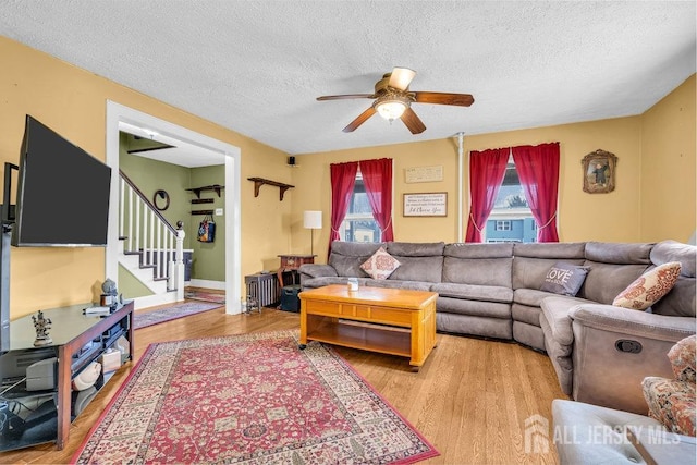 186 Brahma Ave, Bridgewater, NJ 08807 - living area with ceiling fan, a textured ceiling, stairway, and light wood-style flooring