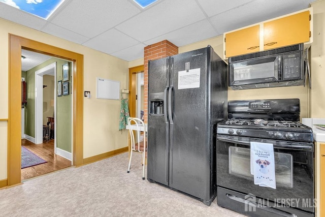 186 Brahma Ave, Bridgewater, NJ 08807 - kitchen with black appliances, a paneled ceiling, light carpet, and baseboards