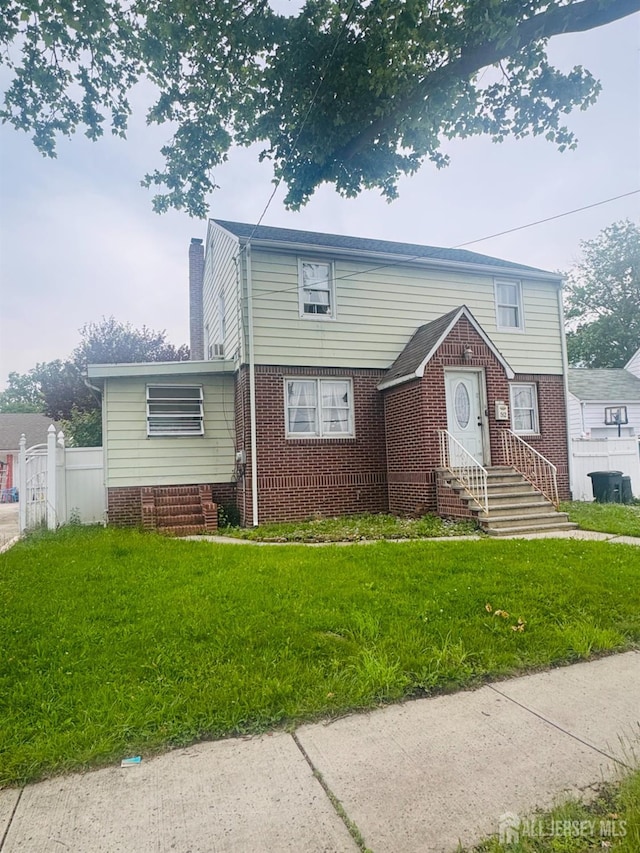 52 Hermann Ave, Carteret, NJ 07008 - view of front of home featuring brick siding, a chimney, and entry steps
