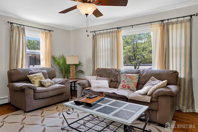 858 Burnt Tavern Rd, Brick, NJ 08724 - living room with wood finished floors, a ceiling fan, ornamental molding, and baseboard heating
