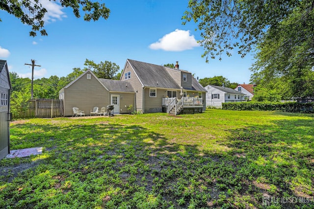 858 Burnt Tavern Rd, Brick, NJ 08724 - rear view of house with a wooden deck, a chimney, and a patio area