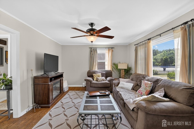 858 Burnt Tavern Rd, Brick, NJ 08724 - living room featuring healthy amount of natural light, wood finished floors, ceiling fan, and crown molding