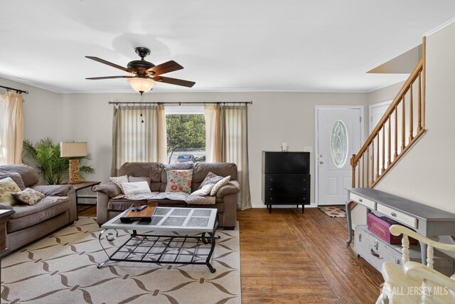 858 Burnt Tavern Rd, Brick, NJ 08724 - living room featuring stairway, wood finished floors, a ceiling fan, ornamental molding, and a baseboard heating unit