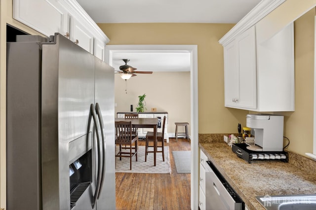 858 Burnt Tavern Rd, Brick, NJ 08724 - kitchen with appliances with stainless steel finishes, dark wood-style flooring, ceiling fan, white cabinets, and light stone countertops