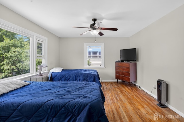 858 Burnt Tavern Rd, Brick, NJ 08724 - bedroom with multiple windows, light wood-style flooring, and ceiling fan