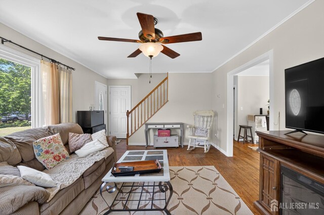 858 Burnt Tavern Rd, Brick, NJ 08724 - living room with stairway, a ceiling fan, wood finished floors, and crown molding