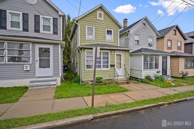 traditional-style home with entry steps