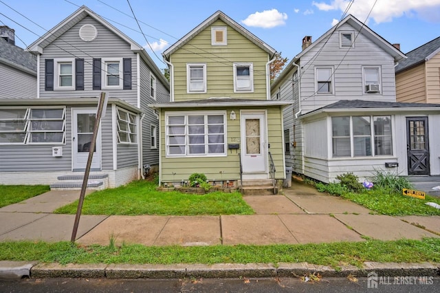 traditional home featuring entry steps