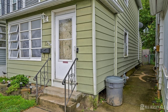 view of side of property featuring entry steps