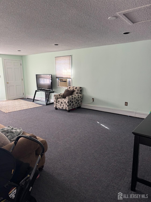 unfurnished living room featuring baseboard heating, a textured ceiling, baseboards, and carpet floors