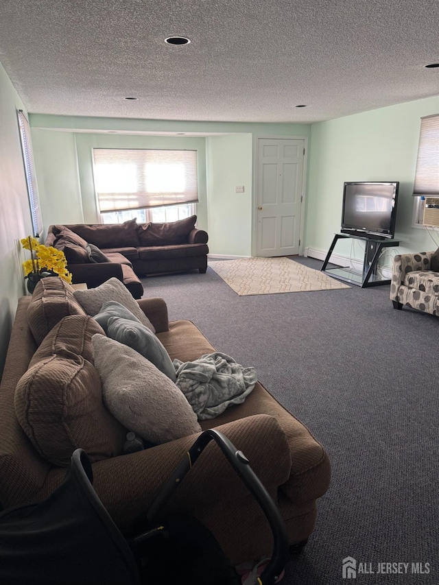 living room with cooling unit, carpet floors, a textured ceiling, and baseboards