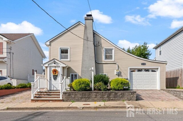 front facade with a garage