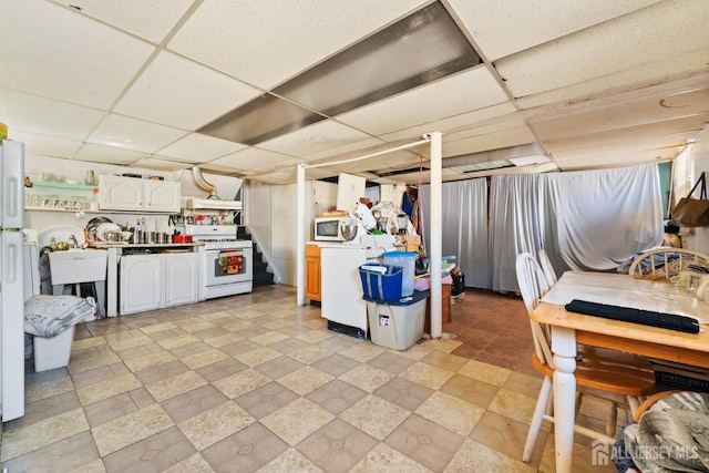 39 Webb Dr, Fords, NJ 08863 - kitchen with white appliances, a paneled ceiling, under cabinet range hood, white cabinets, and light countertops