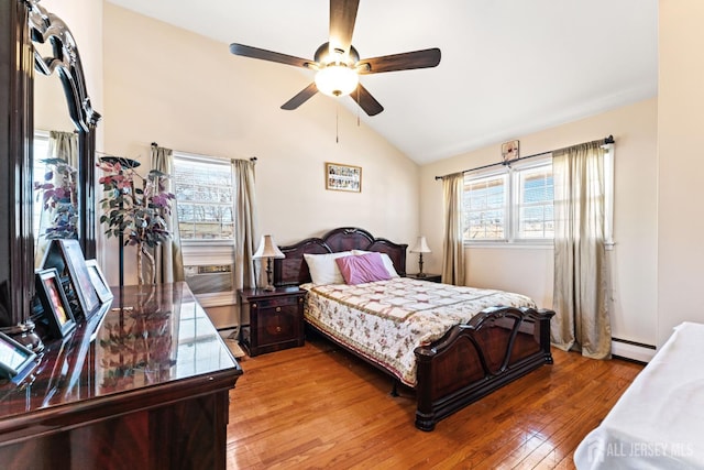 39 Webb Dr, Fords, NJ 08863 - bedroom featuring a baseboard heating unit, vaulted ceiling, light wood finished floors, and a ceiling fan