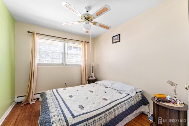 39 Webb Dr, Fords, NJ 08863 - bedroom featuring wood finished floors, baseboard heating, and ceiling fan