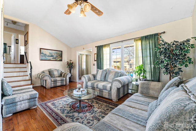 39 Webb Dr, Fords, NJ 08863 - living room featuring ceiling fan, lofted ceiling, wood finished floors, stairway, and a baseboard radiator
