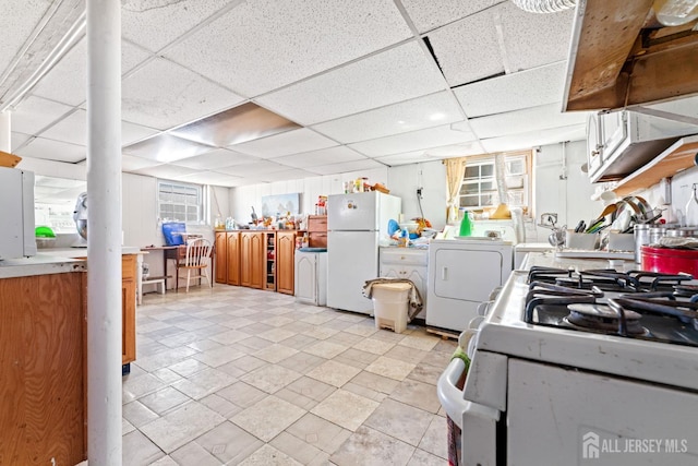 39 Webb Dr, Fords, NJ 08863 - kitchen featuring white appliances, a paneled ceiling, and washer and dryer