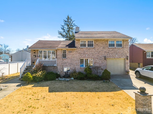 39 Webb Dr, Fords, NJ 08863 - split level home featuring brick siding, an attached garage, driveway, a chimney, and stairs