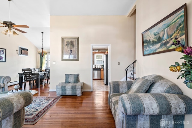 39 Webb Dr, Fords, NJ 08863 - living room featuring ceiling fan, healthy amount of natural light, wood finished floors, and vaulted ceiling