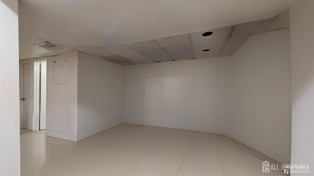 spare room with a drop ceiling