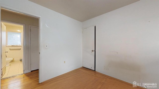 spare room featuring hardwood / wood-style flooring