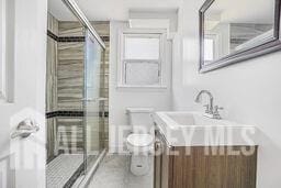 212 Huff Ave, Manville, NJ 08835 - full bath with toilet, vanity, and a stall shower