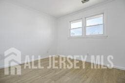 212 Huff Ave, Manville, NJ 08835 - spare room with baseboards and ornamental molding