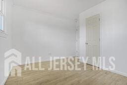 212 Huff Ave, Manville, NJ 08835 - unfurnished room with wood finished floors and baseboards