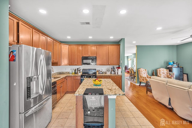 36 Andrews Way, Piscataway, NJ 08854 - kitchen featuring stainless steel appliances, open floor plan, recessed lighting, light stone countertops, and light tile patterned floors