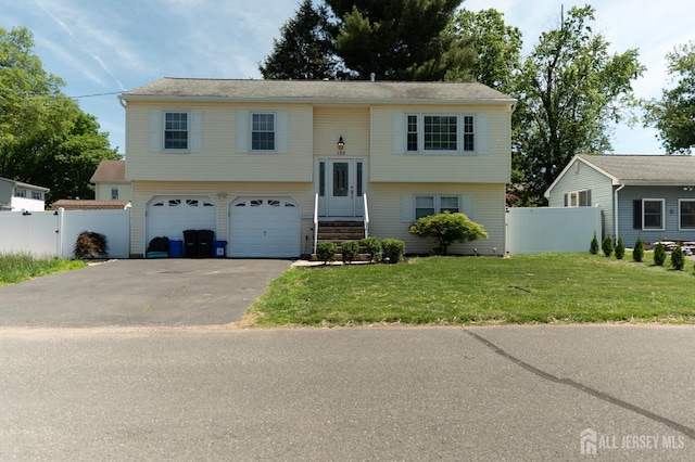128 Jay St, Middlesex, NJ 08846 - split foyer home with an attached garage and asphalt driveway