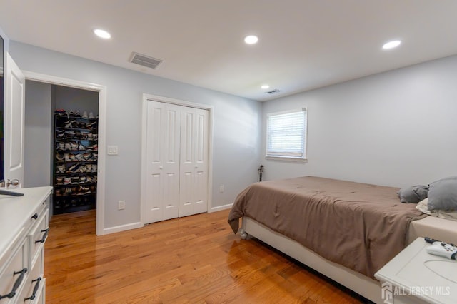 128 Jay St, Middlesex, NJ 08846 - bedroom with light wood-type flooring, recessed lighting, baseboards, and a closet