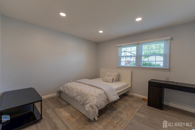 128 Jay St, Middlesex, NJ 08846 - bedroom with wood finished floors, baseboards, and recessed lighting