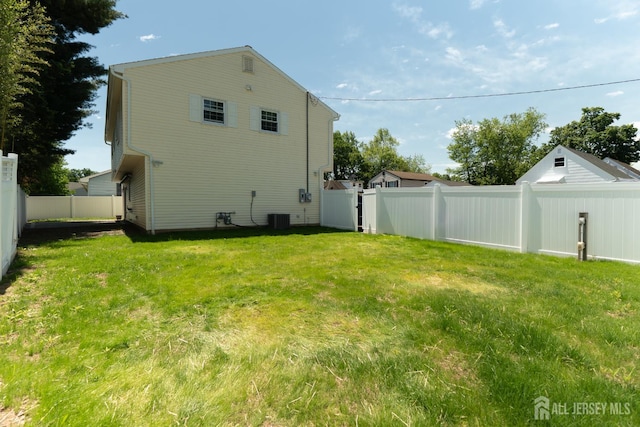 128 Jay St, Middlesex, NJ 08846 - back of house featuring central AC