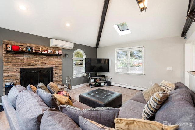 living room with baseboard heating, a wall mounted AC, lofted ceiling with skylight, and light hardwood / wood-style floors