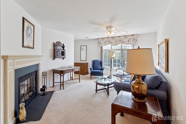 40 Rutland Ln Unit 40C, Monroe, NJ 08831 - living room with ceiling fan, carpet flooring, and a fireplace with flush hearth